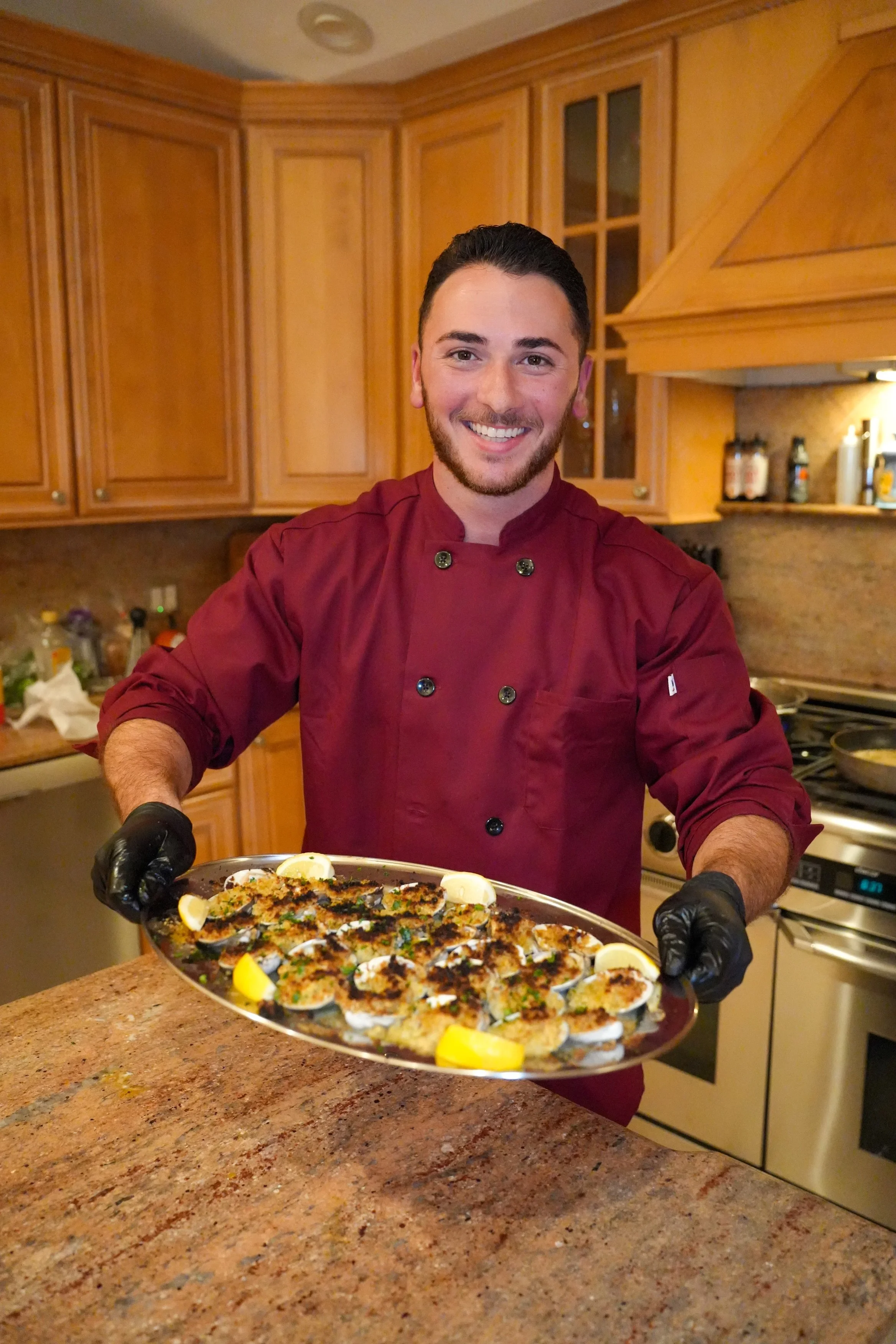 Chef holding Italian dish